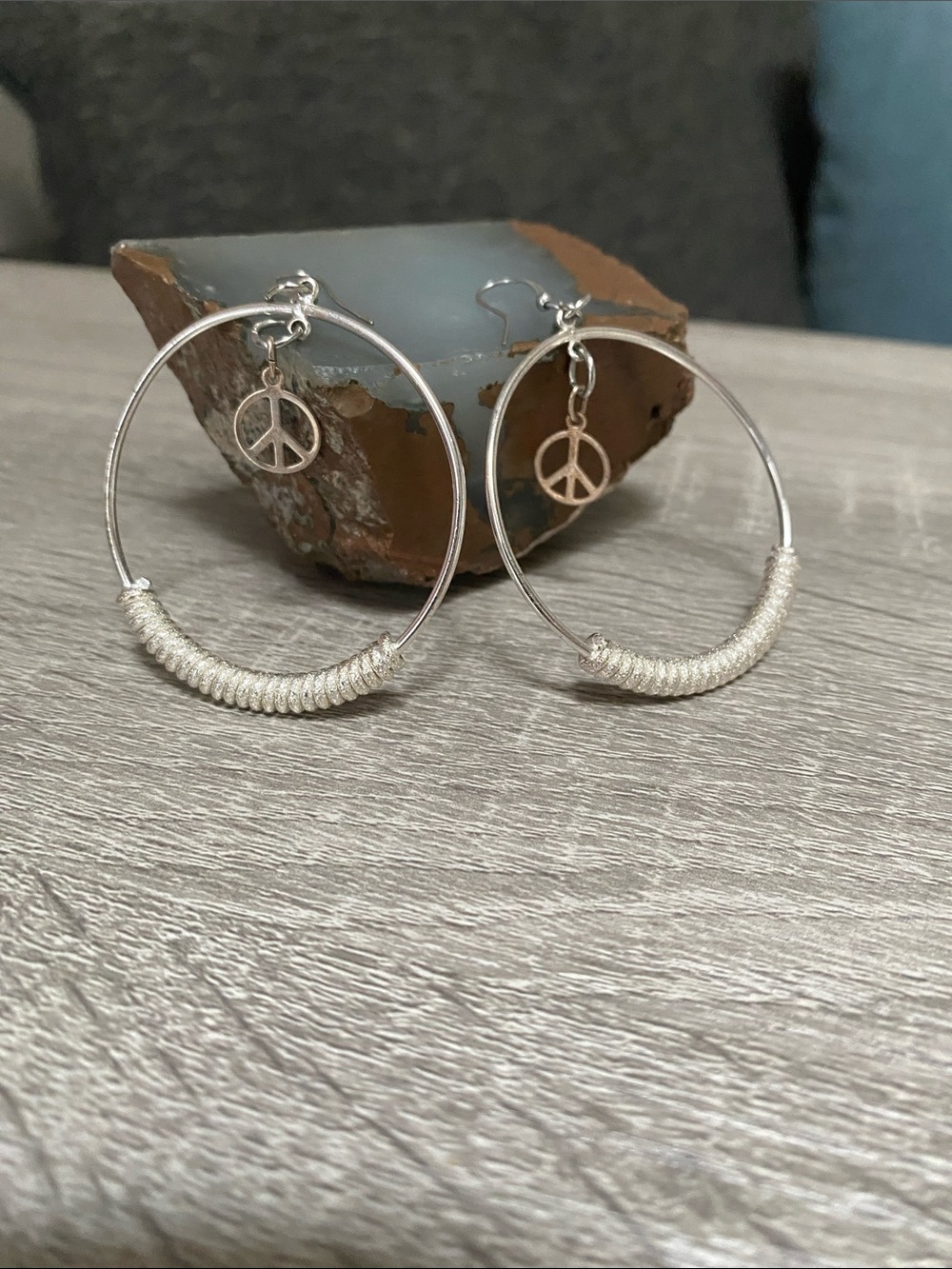 Silver Hoop Earrings with Cream Wrapped Detail and Peace Charm